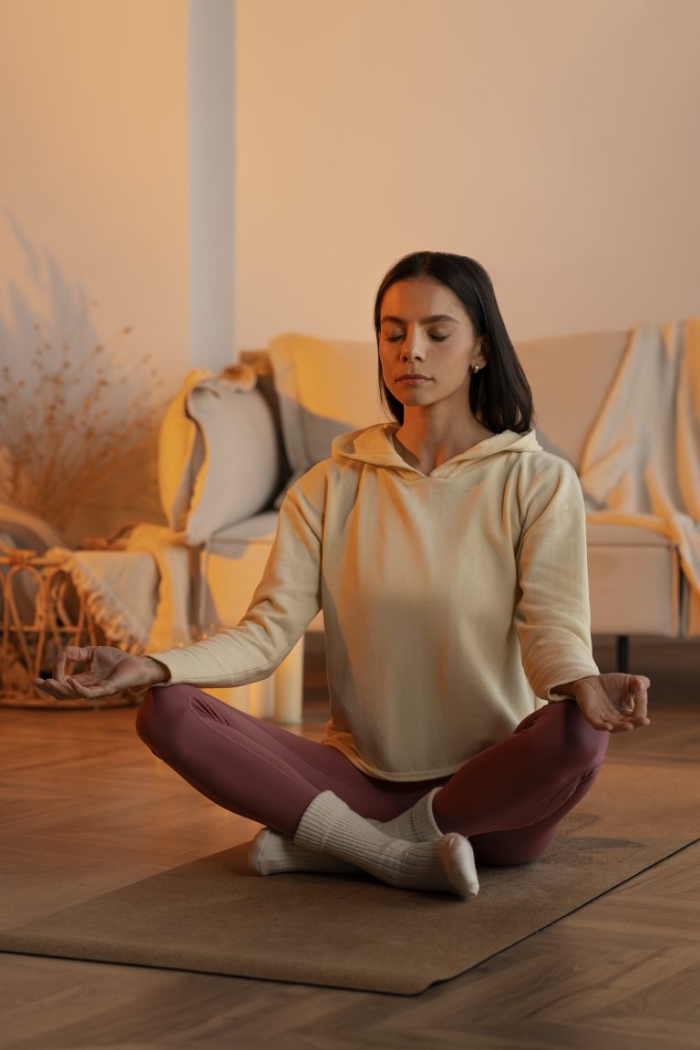 woman-meditating-mat-full-shot