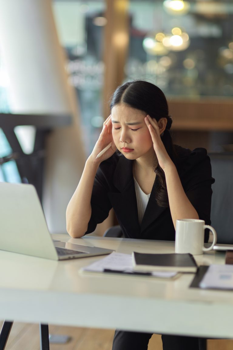 Portrait of busy businesswoman pensive thinking finding business problems solutions working on her project in office.